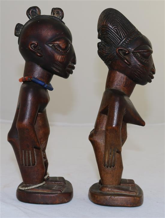 Two Yoruba wood figures of a man and a woman, late 19th/early 20th century, 9in.